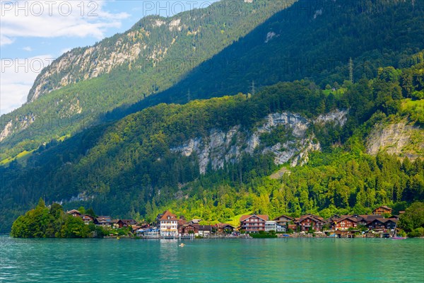 Village Iseltwald and Mountain on Lake Brienz in a Sunny Day in Iseltwald