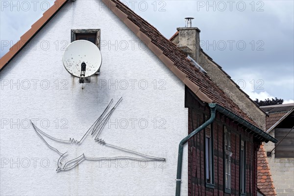 House facade with satellite antenna