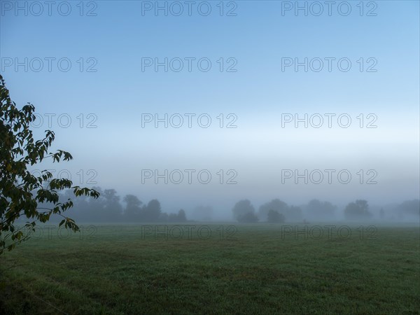 Landscape and meadows in the morning mist in autumn