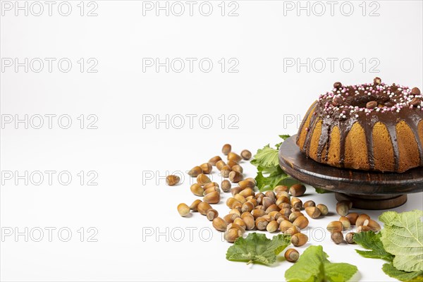 Vegan hazelnut cake on wooden serving plate