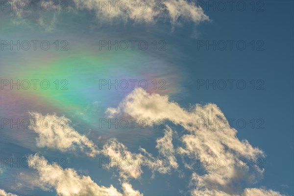 Quite rare optical phenomenon of iridescence of clouds of pearly