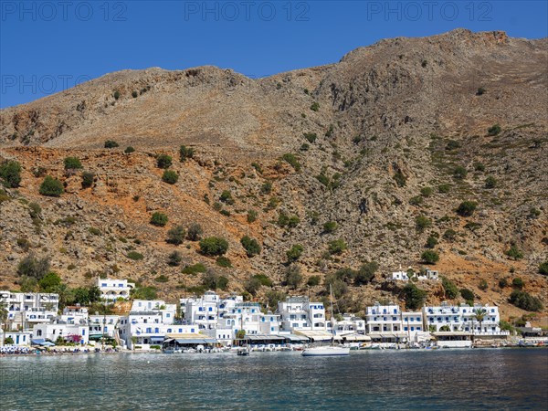 The car-free Loutro below a rocky mountain