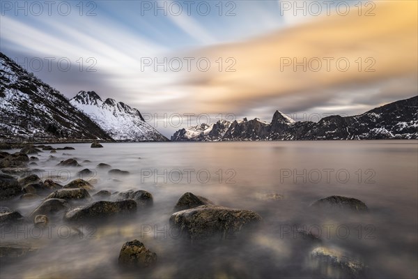 Snowy mountains by the fjord