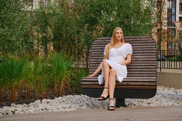 Young woman resting on a rotating bench