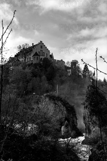 Rhine Falls and Swiss Flag with the Castle Laufen at Neuhausen