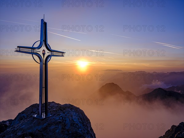 Summit cross Hoher Goell at sunrise