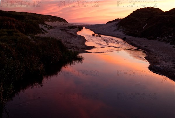 The river into the sea after sunset