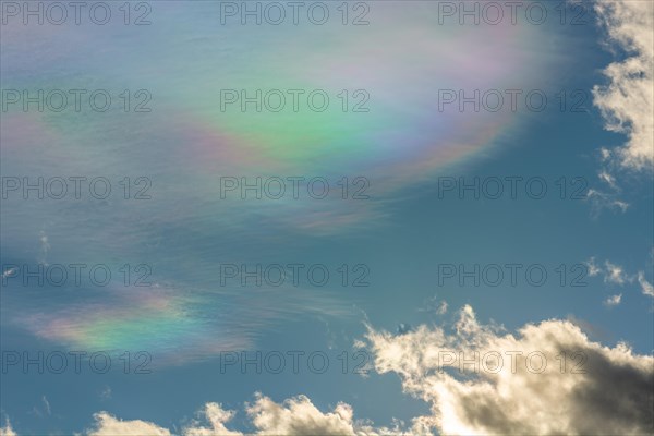 Quite rare optical phenomenon of iridescence of clouds of pearly