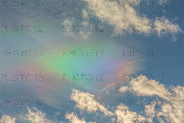 Quite rare optical phenomenon of iridescence of clouds of pearly