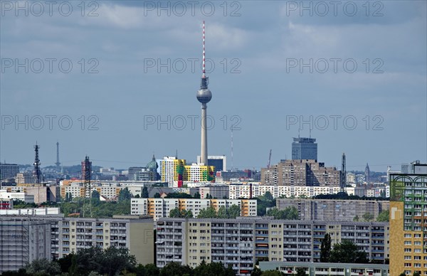 View through a telephoto lens from the Kienberg in the district of Marzahn-Hellersdorf to the TV tower in the district of Mitte