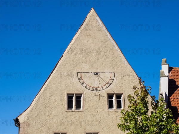 Sundial on the gable of a house