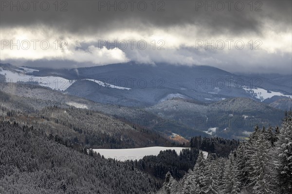 Fresh snow in November with a wonderful view of the Black Forest in a cloudy atmosphere