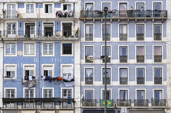 Windows and balconies with facade of traditional azulejo wall tiles