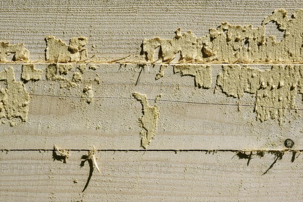 Wooden beams with remains of sawdust in a sawmill