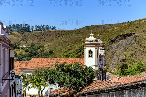 Tower of historic baroque church among the houses