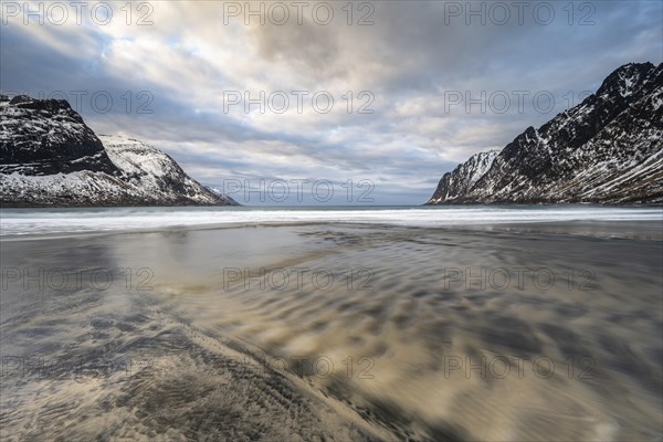 Sandy beach beach with mountains