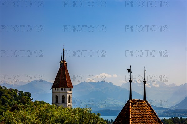 Church Tower with Lake Thun and Mountain View and Blue Clear Sky in a Sunny Day in Thun