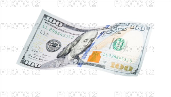 One hundred dollar bill falling or floating on empty background