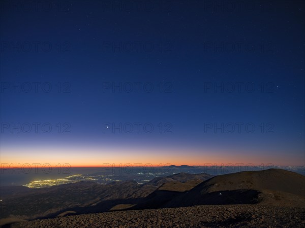 Dawn over Heraklion under starry sky