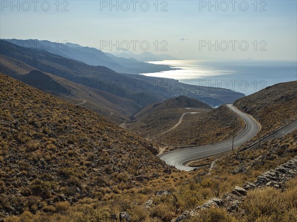 View over Anapoli Gorge to mountain road and mountains of the south coast
