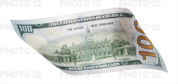 One hundred dollar bill falling or floating on empty background