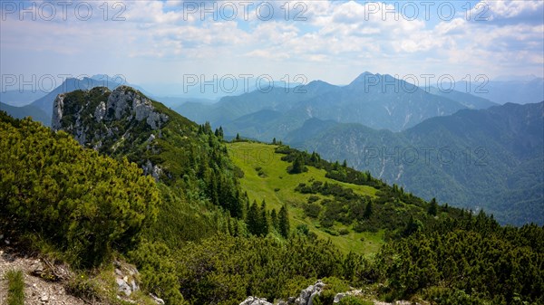 View from the summit of Gurnwandkopf to the neighbouring peak Hoerndlwand and the mountains in the nature reserve Eastern Chiemgau Alps with the Sonntagshorn