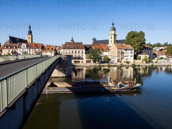 Cargo ship under a bridge