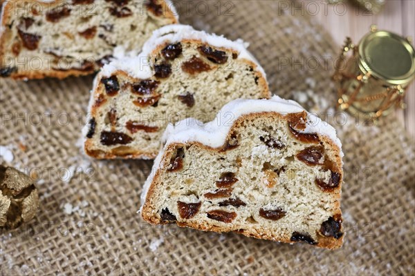 Slices of traditional German christmas season sweet food called 'Stollen' or 'Christstollen'