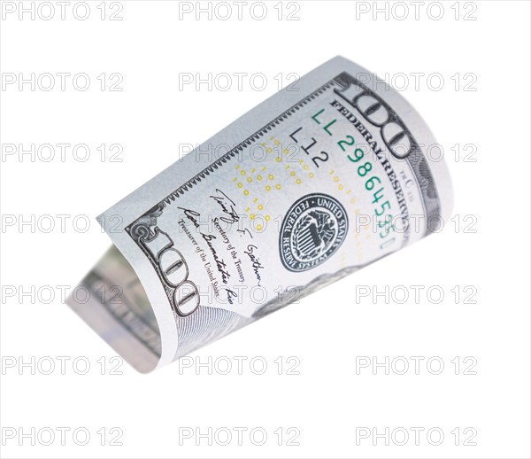 One hundred dollar bill falling or floating on empty background