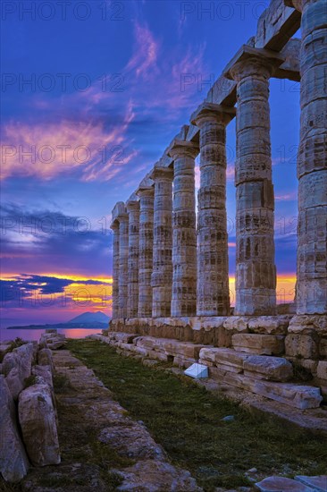 Beautiful sunset sky and ancient ruins of temple of Poseidon