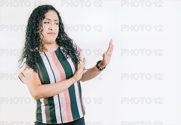 Displeased girl in glasses rejecting with palms hands isolated. Intense displeased young woman with rejection gesture. He frowns in disgust