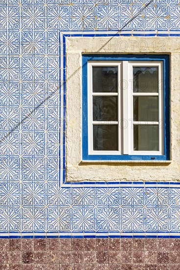 Traditional azulejo wall tiles and window