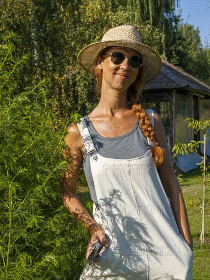 Woman in herb bed