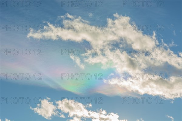 Quite rare optical phenomenon of iridescence of clouds of pearly