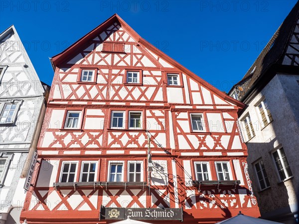 Half-timbered house in the main street with row of half-timbered houses