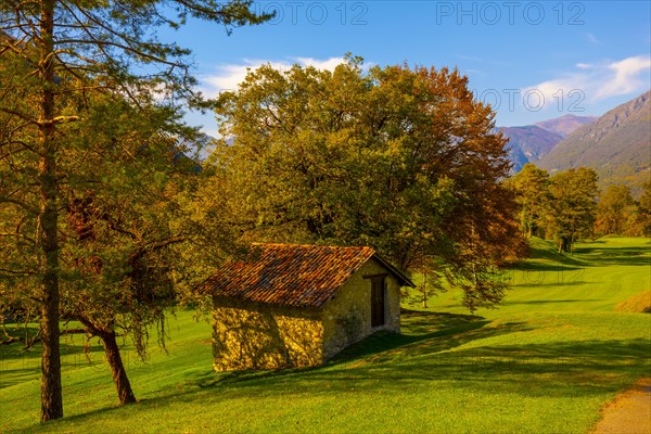 Hut on Golf Course Menaggio with Mountain View in Autumn in Lombardy
