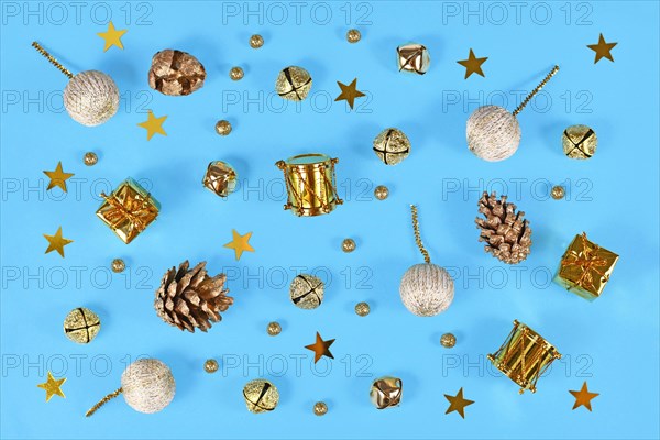 Christmas flat lay with golden ornaments like small drums