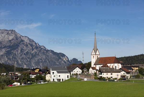 Village view with parish church of Adnet with Untersberg