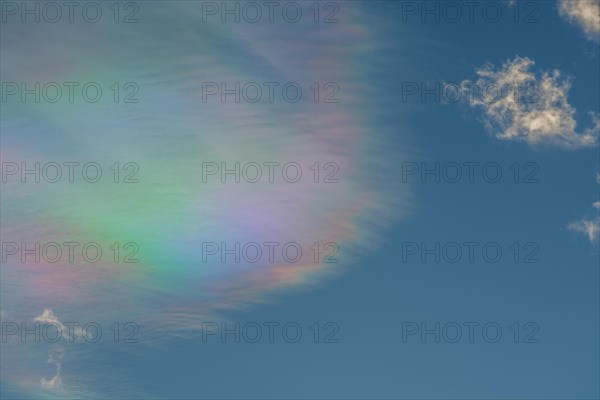 Quite rare optical phenomenon of iridescence of clouds of pearly