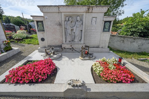 Gravestone with begonias