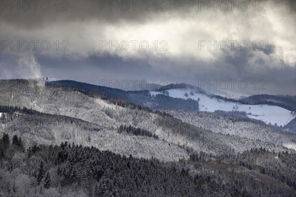 Fresh snow in November with a wonderful view of the Black Forest in a cloudy atmosphere