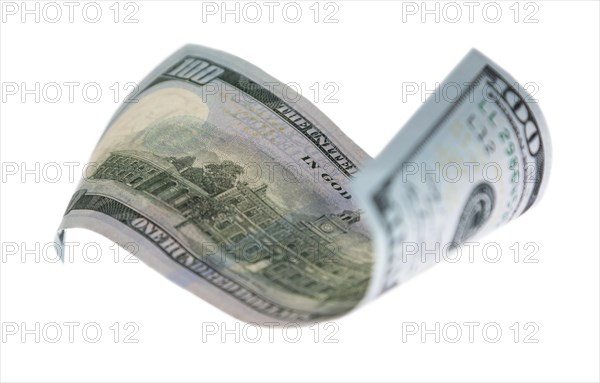 One hundred dollar bill falling or floating on empty background