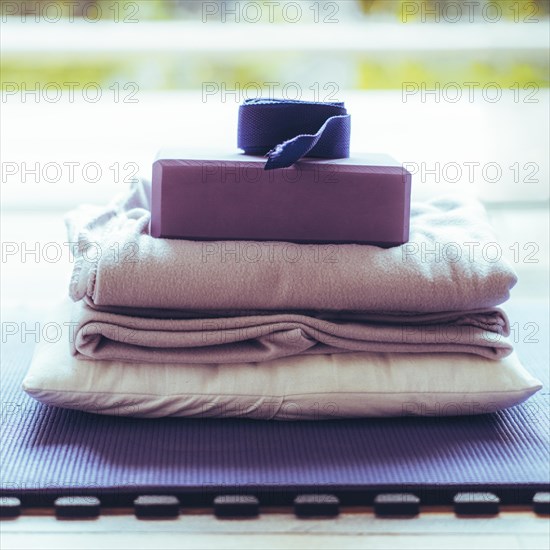 Yoga equipment placed on floor. Yoga mat