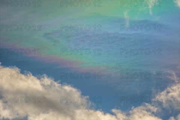 Quite rare optical phenomenon of iridescence of clouds of pearly