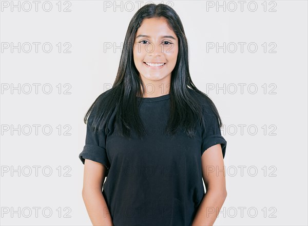 Portrait of happy Young girl with serene look isolated. Portrait of attractive latin girl smiling isolated. Nicaraguan woman concept in isolated background