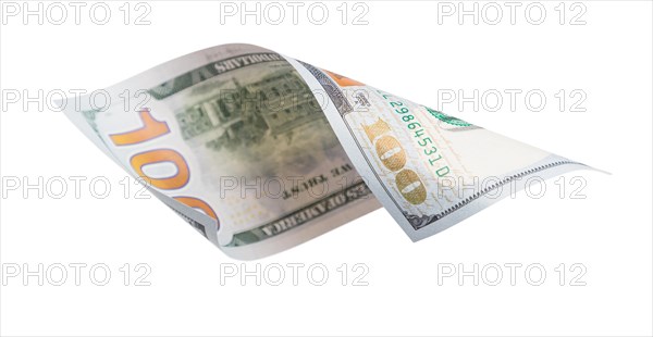 One hundred dollar bill falling or floating on empty background