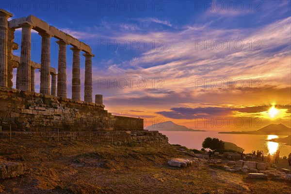 Beautiful sunset sky and ancient ruins of temple of Poseidon