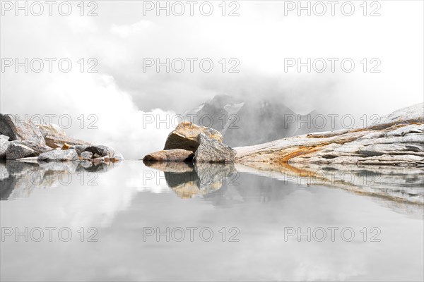 Reflection in the meltwater lake of the Stampflkees glacier