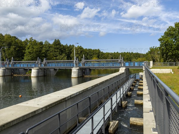 Weir on the river Spree with fish ladder and bridge