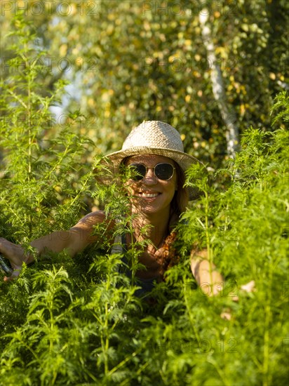 Woman in herb bed